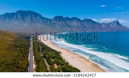 Kogelbay beach Western Cape South Africa, Kogelbay Rugged Coast Line with spectacular mountains. Garden route, drone aerial view at the road and beach Royalty-Free Stock Photo #2184262417