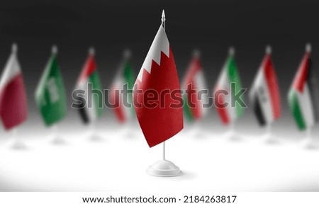 The national flag of the Bahrain on the background of flags of other countries