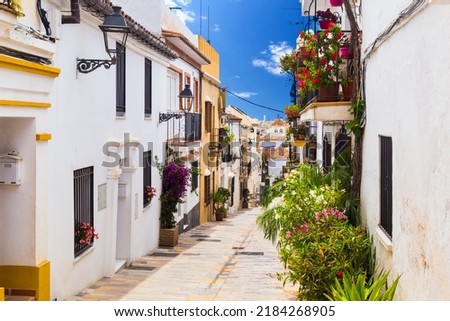 A picturesque narrow street in Marbella old town, province of Malaga, Spain. Royalty-Free Stock Photo #2184268905