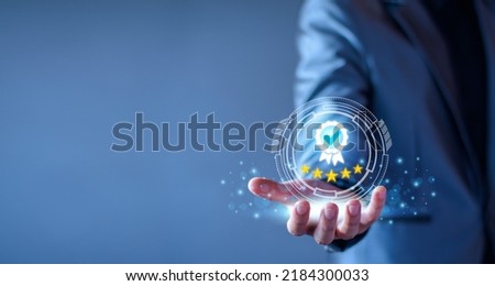 Quality Assurance Concept. Business people show high quality assurance mark, good service, premium, five stars, premium service assurance, excellence service, high quality, business excellence. Royalty-Free Stock Photo #2184300033