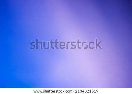 Illuminated light with gobo mask on purple  background.