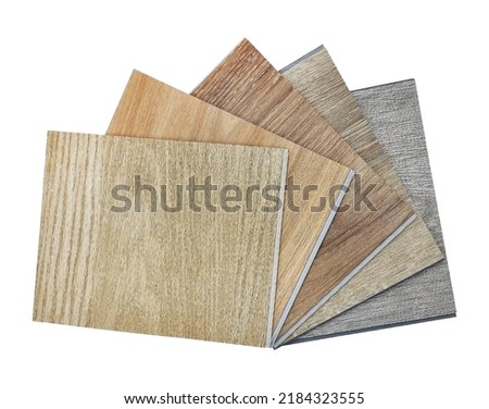 modern vinyl flooring tile collection. stack of samples of vinyl sheet catalog in multi color and texture for customer selection. isolated on background with clipping path. Royalty-Free Stock Photo #2184323555