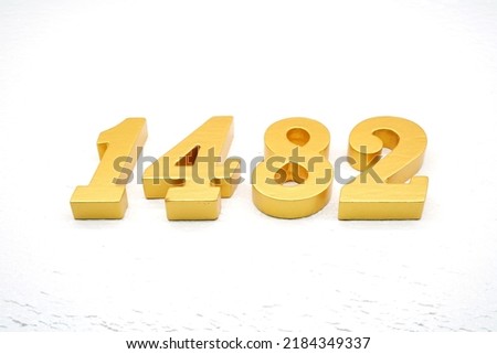   Number 1482 is made of gold painted teak, 1 cm thick, laid on a white painted aerated brick floor, visualized in 3D.                              