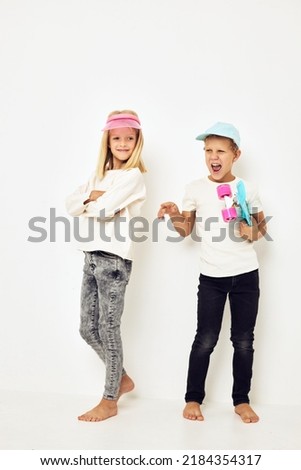 Modern teenagers posing together play more fun together isolated background