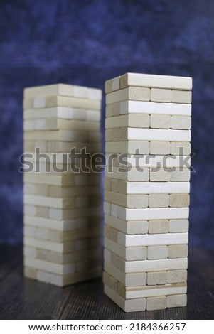 Board game with wooden bricks. Wooden tower for playing with friends