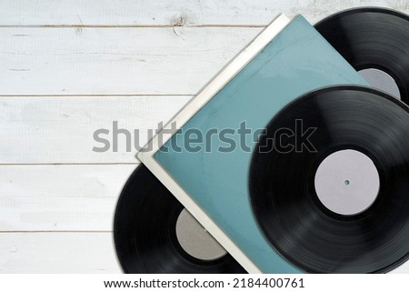 Vinyl records, party music, top view. Empty copy space for record label mockup. Vintage retro sound recording style. Background for the design of a poster, postcard, and flyer for music events.