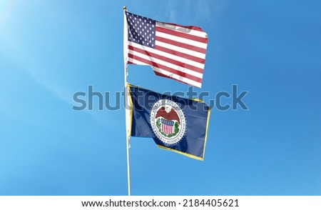 American flag and US Federal Reserve with blue sky. waving in the sky