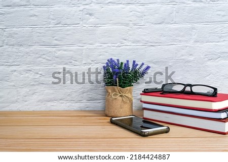 Office desk with supplies and wooden background. Copy space. Workspace concept.