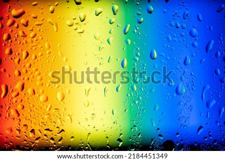 abstract picture with rainbow under water drops