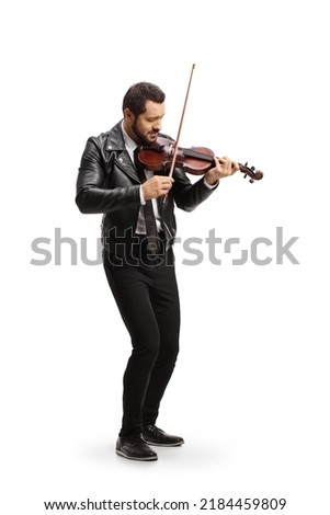 Full length shot of a young trendy man playing a violin isolated on white background 