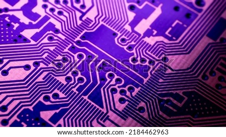 a printed circuit board in red Royalty-Free Stock Photo #2184462963