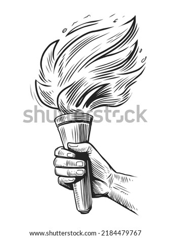 Torch with flaming fire in hand sketch. Shining torch on raised hand isolated. Vector illustration in engraving style