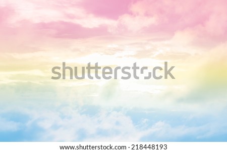 A soft cloud background with a pastel colored orange to blue gradient.
