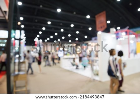 Abstract blur people in exhibition hall event trade show expo background. Large international exhibition, convention center, business marketing and event fair organizer concept. Royalty-Free Stock Photo #2184493847