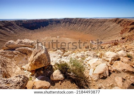 Large Rocky Desert Meteor Impact Crater clear sky