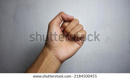 Hand clenched sign isolated on white background  Royalty-Free Stock Photo #2184500455