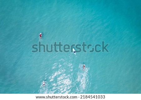 Surfers in the blue ocean top view Beautiful sea in summer season at Phuket Thailand