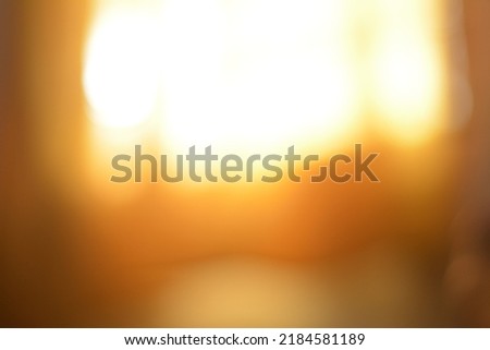 Blurred photograph of yellow light leak background for abstract art project