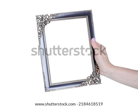 Empty photo frame in hand on white background isolation