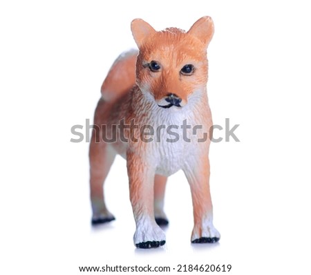 Figurine small dog on white background isolation