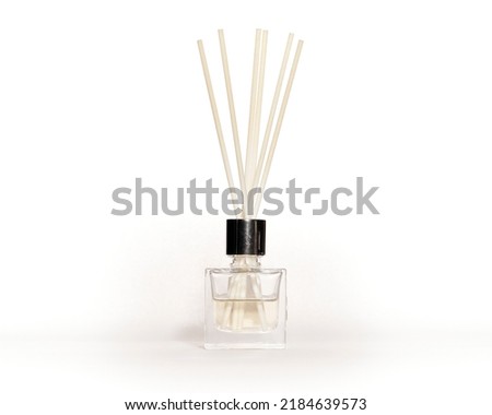  Wooden aroma sticks in a glass flask filled with flavor liquid substance isolated over white background, side view                               Royalty-Free Stock Photo #2184639573