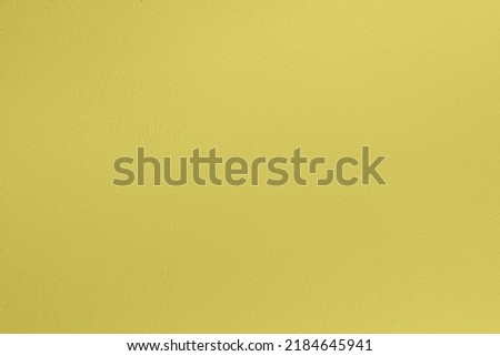 Saturated light pastel greenish yellow colored low contrast Concrete textured background. Empty colourful wall texture with copy space for text overlay and mockups. 2023, 2024 color trend Royalty-Free Stock Photo #2184645941