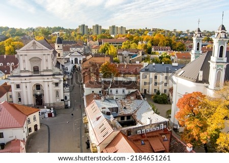 Beautiful Vilnius city panorama in autumn with orange and yellow foliage. Aerial evening view. Fall city scenery in Vilnius, Lithuania