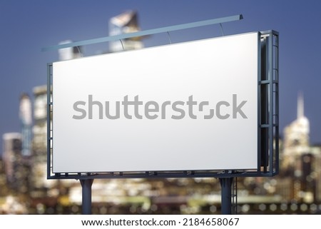 Blank white horizontal billboard on skyline background at evening, perspective view. Mock up, advertising concept