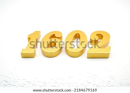   Number 1602 is made of gold painted teak, 1 cm thick, laid on a white painted aerated brick floor, visualized in 3D.                               
