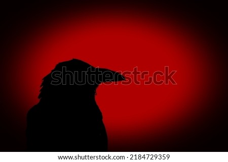 Silhouette of a black crow on a red background.