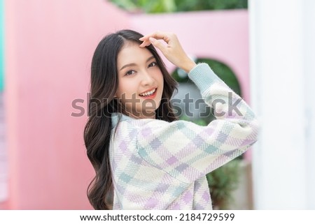 Beautiful asian young woman smile and cheerful. Confident cute female looking at camera relax and happiness with wellness life. good moment and positive emotional. Happy woman enjoy her life concept Royalty-Free Stock Photo #2184729599