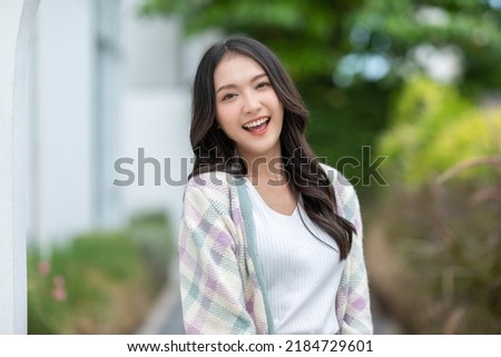 Beautiful asian young woman smile and cheerful. Confident cute female looking at camera relax and happiness with wellness life. good moment and positive emotional. Happy woman enjoy her life concept Royalty-Free Stock Photo #2184729601