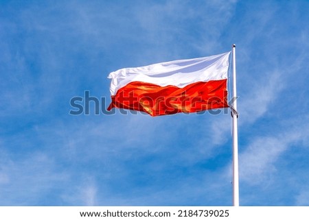 Flag of Poland on the sky background