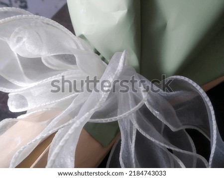 White ribbon fabric to tie and decorate flower bouquets