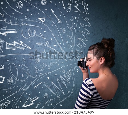 Photographer girl shooting images while energetic hand drawn lines and doodles come out of the camera