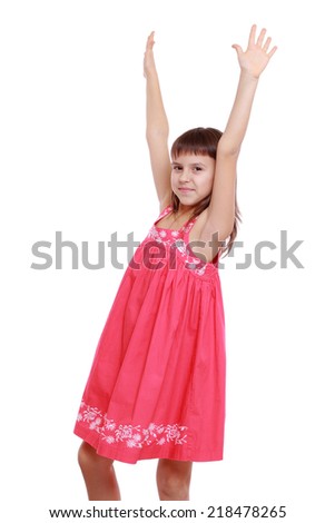 studio image of beautiful little girl wearing lovely summer dress and posing on camera isolated over white background