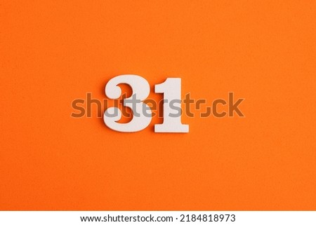 Number 31 - On orange foam rubber background