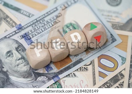 FED wording with up and down arrow on USD dollar banknote for Federal reserve increase and decrease interest rate control which effect to America and world economic growth concept. Royalty-Free Stock Photo #2184828149
