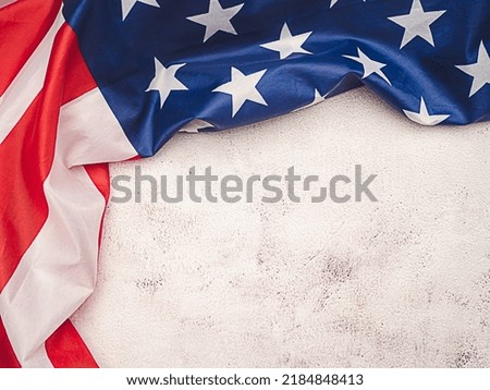 American flag on a cement background with copy space for text. Top view. Close-up photo