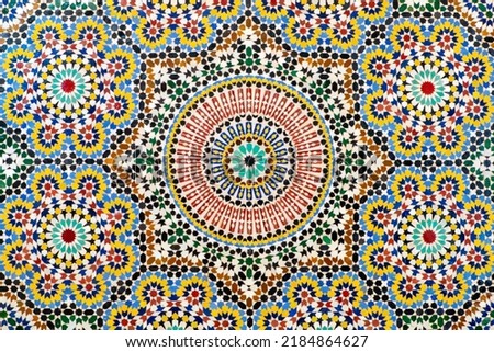 Zellige is traditional Moroccan mosaic tiles with harmonious geometrical patterns and natural colors. the decorative arts of Islam in Andalusia and Morocco.  Royalty-Free Stock Photo #2184864627