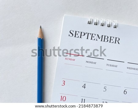 Calendar September with pencil on wood texture.inPlanning concept.