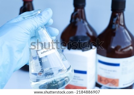 sulfuric acid in glass, chemical in the laboratory and industry Royalty-Free Stock Photo #2184886907