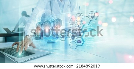 Doctor analyzing and diagnosis patient health with medical innovative technology on laptop.  Medical science development technology prevent people life from health illness and emerging diseases. Royalty-Free Stock Photo #2184892019
