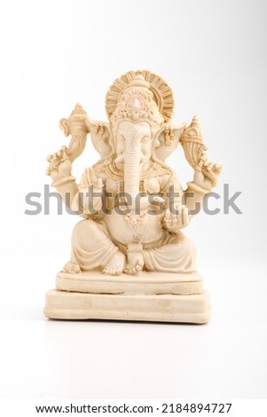 antique lord ganesha sculpture on white background.
