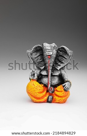 antique lord ganesha sculpture on white background. Royalty-Free Stock Photo #2184894829