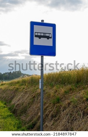 road sign. Traffic sign for bus station with sky background. Bus stop sign. blue bus stop road sign. Bus stop in the countryside.  