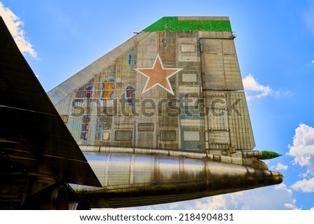 a red star on the tail of an airplane against a blue sky background. High quality photo
