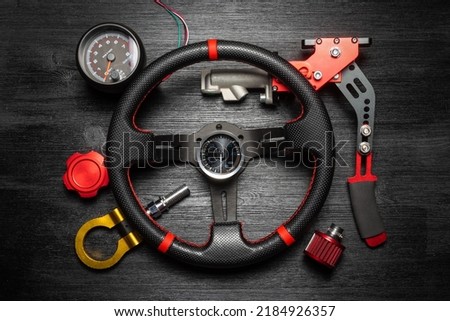 Sport car tuning gear concept flat lay background with copy space. Motorsport automobile equipment. Royalty-Free Stock Photo #2184926357