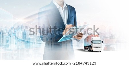 Smart Logistics and Warehouse Technology Management System Concept, Businessman using tablet control truck delivery network distribution import export, Double exposure business future Transportation Royalty-Free Stock Photo #2184943123