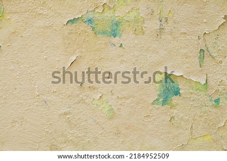 Grunge old cracked yellow vintage stucco background